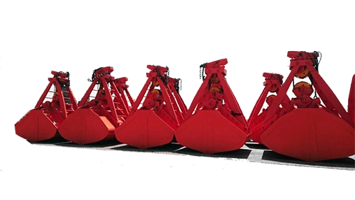 Rapidpack clamshell grabs lined up outdoors, heavy-duty hydraulic grips open above surface